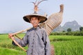 Old man of Zhuang minority in the fields of Yangshuo, China